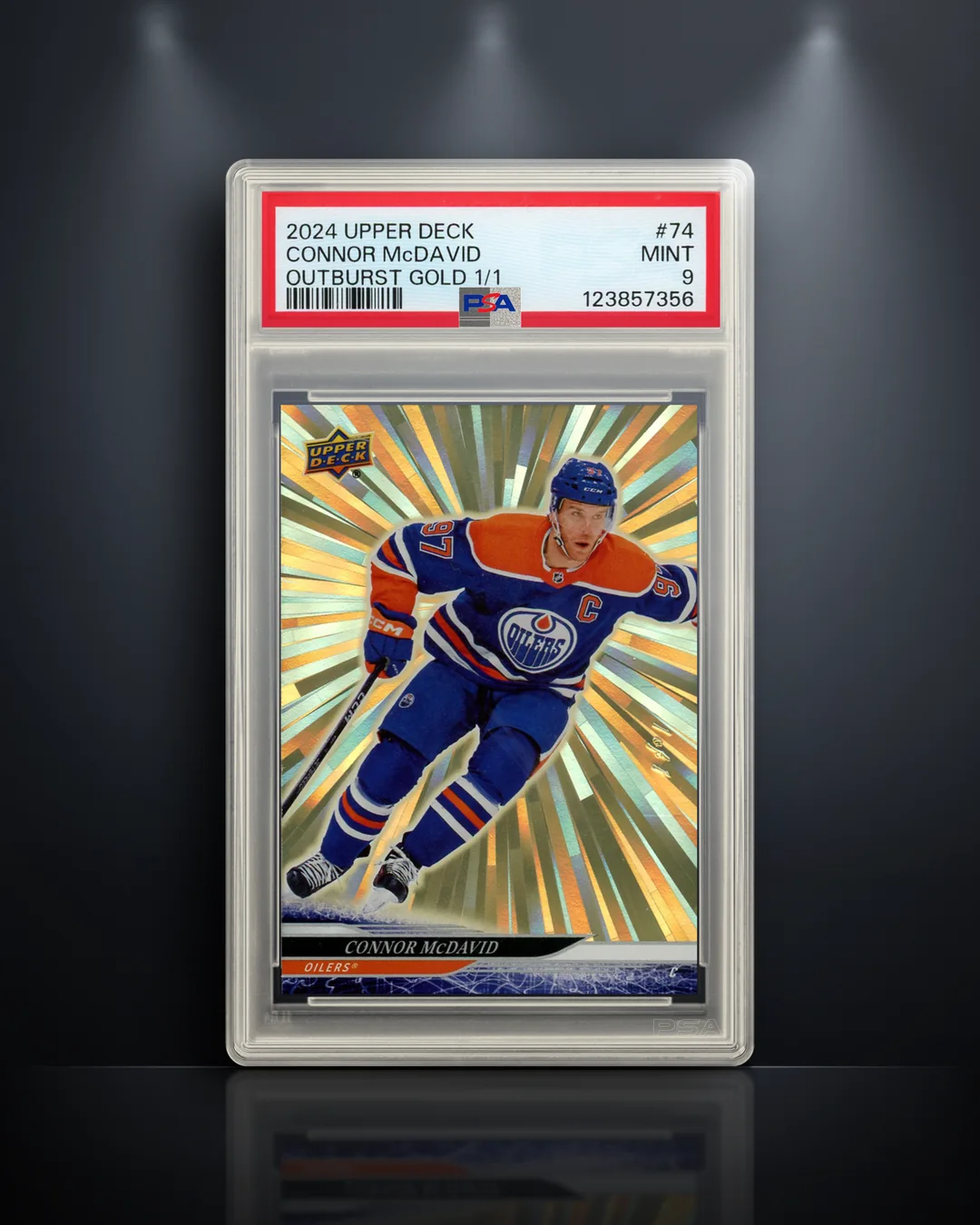 A PSA 9 Connor McDavid Outburst Gold 1/1 in Panoply's Vault style